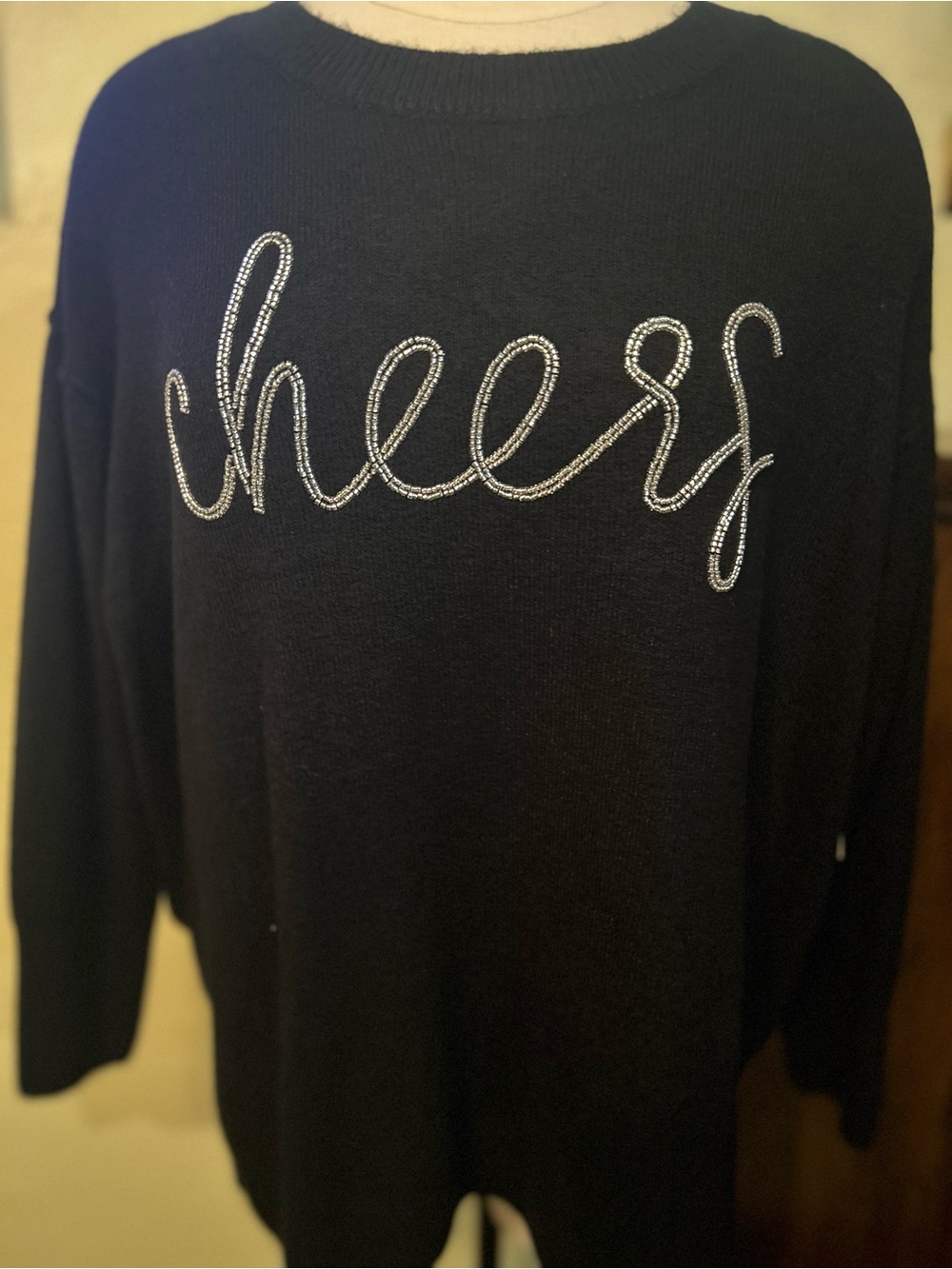 CeCe Black Crewneck Sweater with Rhinestone 'Cheers' Script